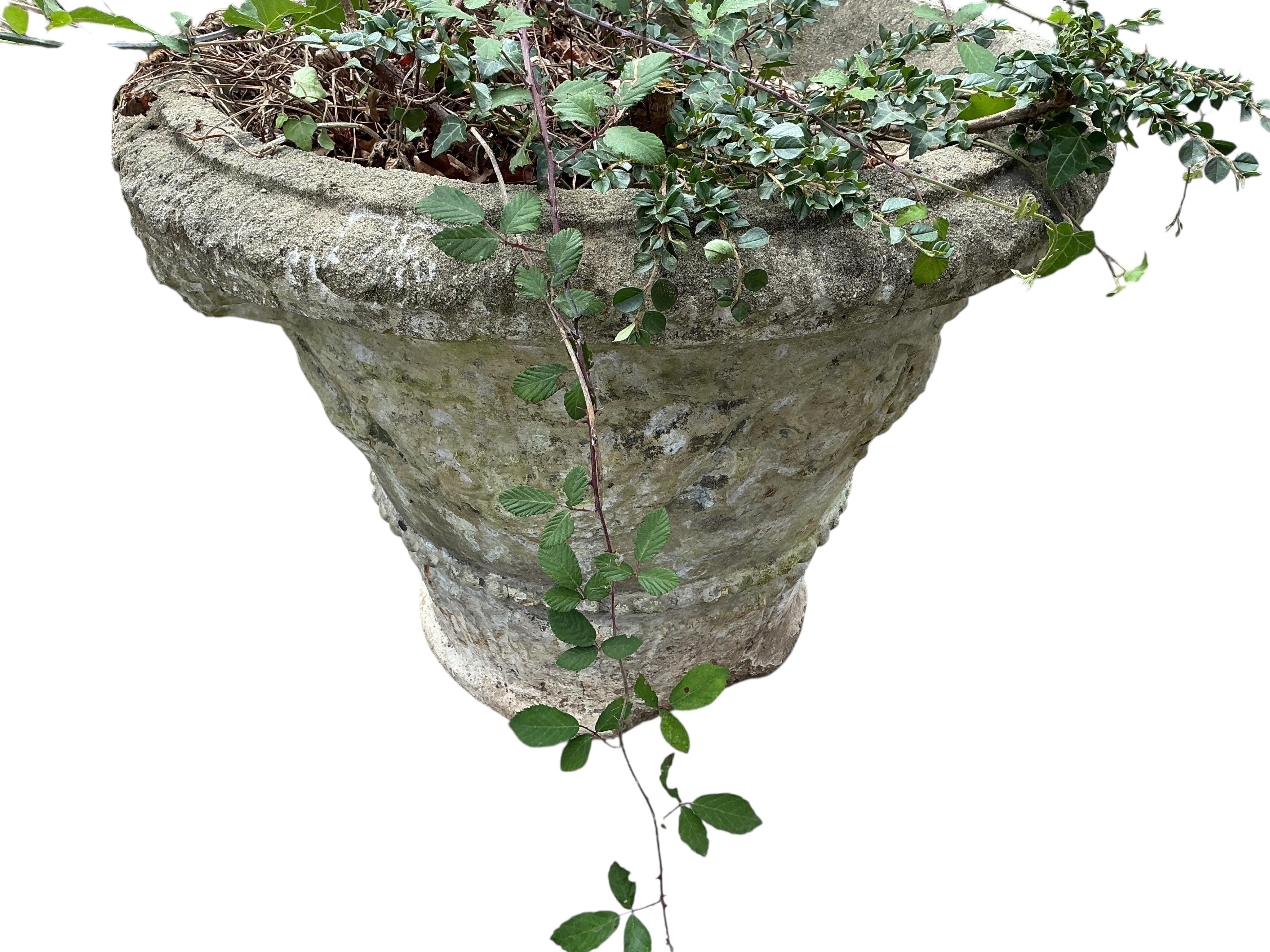 A pair of reconstituted stone garden planters, diameter 60cm, height 48cm